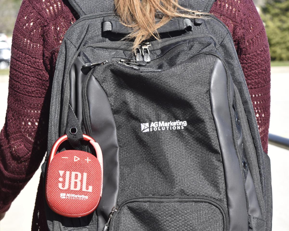 personalized JBL wireless speaker attached to a backpack