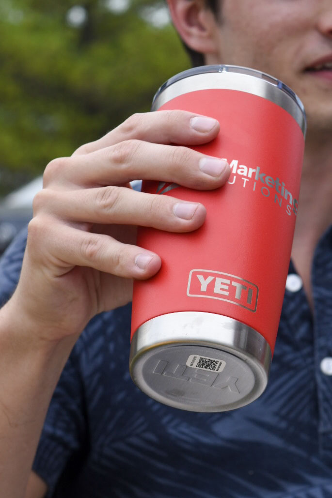 hand holding Yeti Rambler